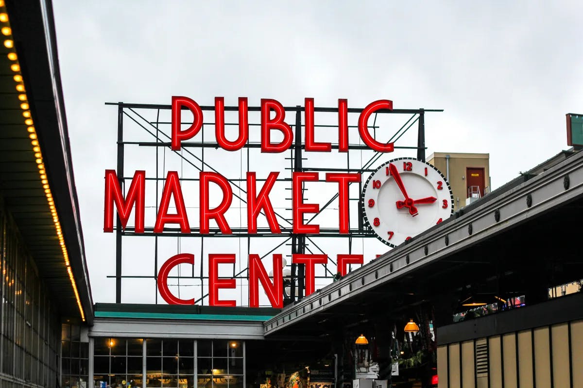 A picture of a Public Market Center signage during daytime.