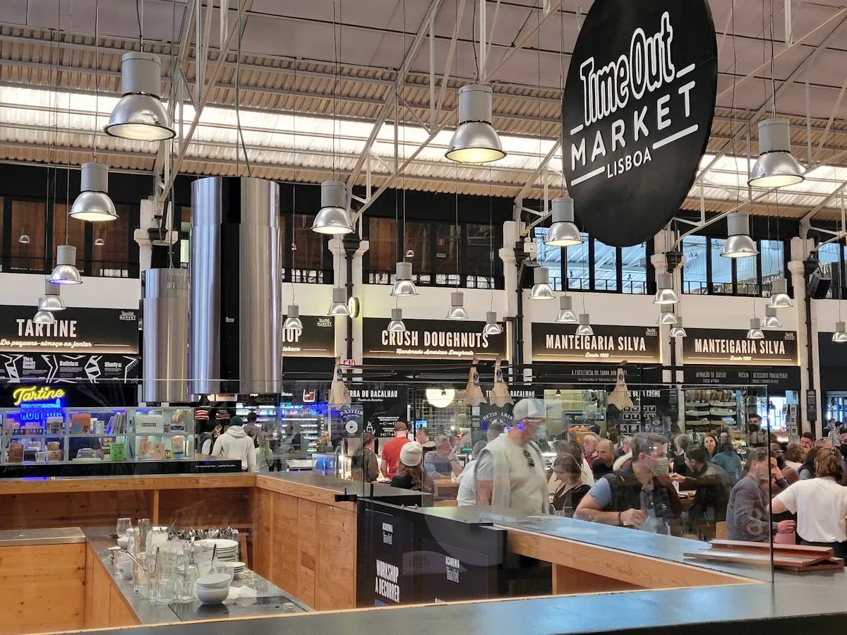 A "Time Out" sign hung above a food court in a local market.