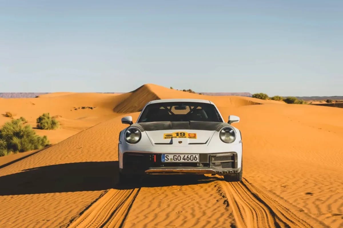 A white car in the desert