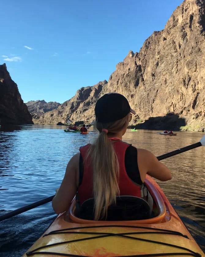Travel advisor kayaking in a lake