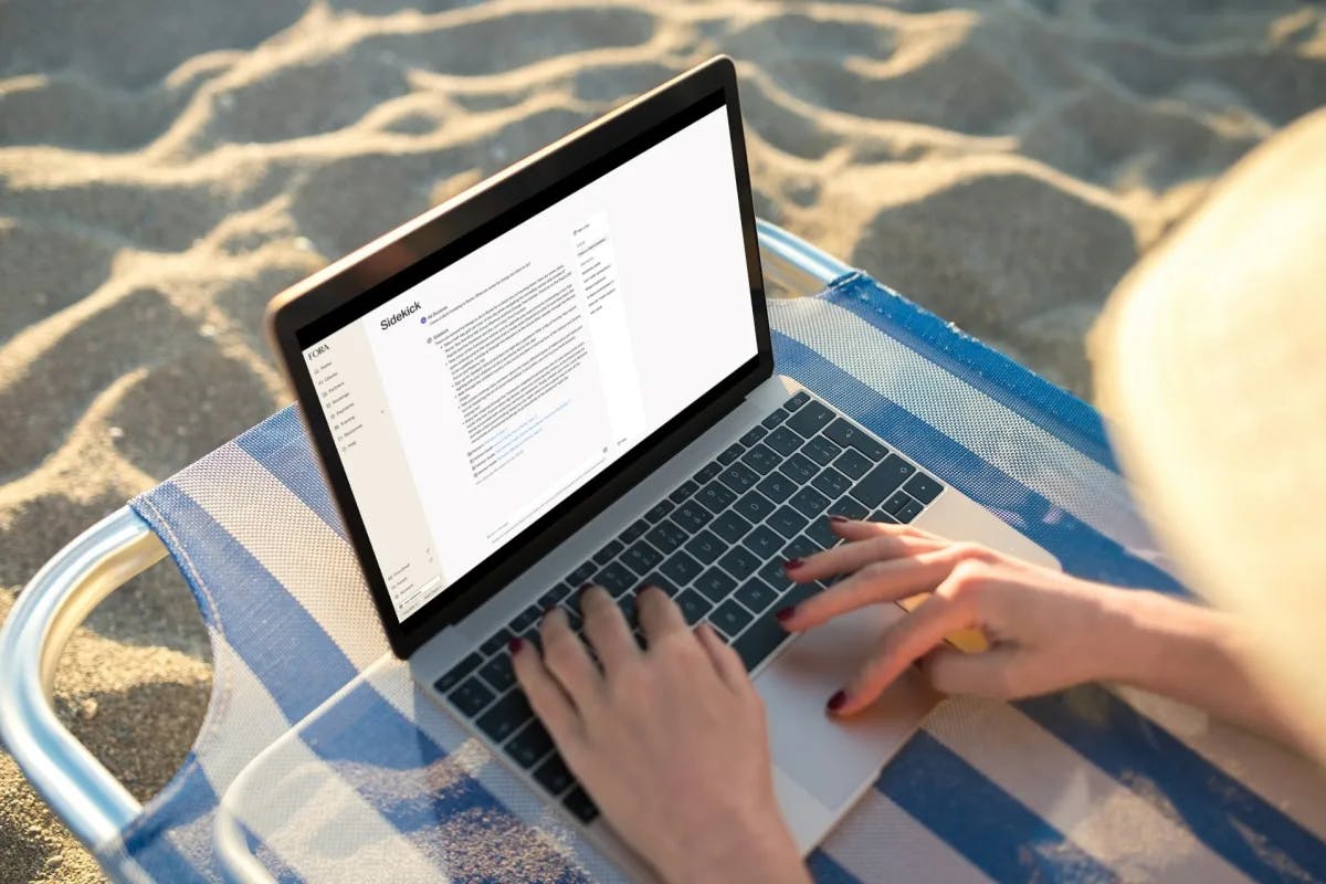 laptop computer with hands on the keyboard