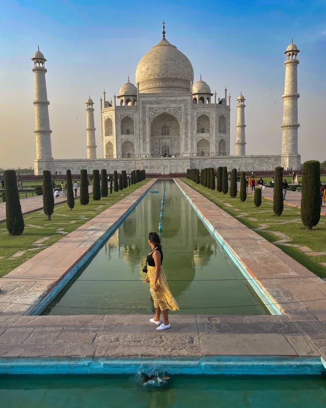 Travel advisor in front of the Taj Mahal.