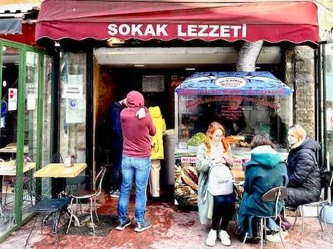 Cafe in Istanbul with people sitting and eating outside