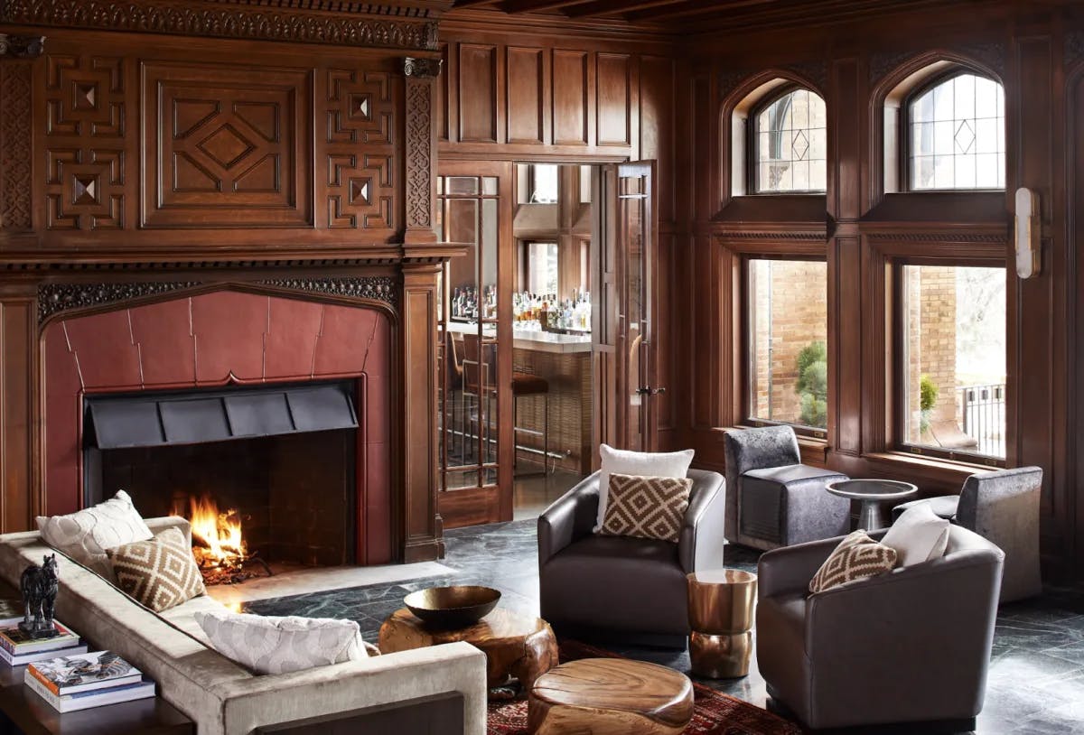 a cozy living room with plush furniture and a fireplace
