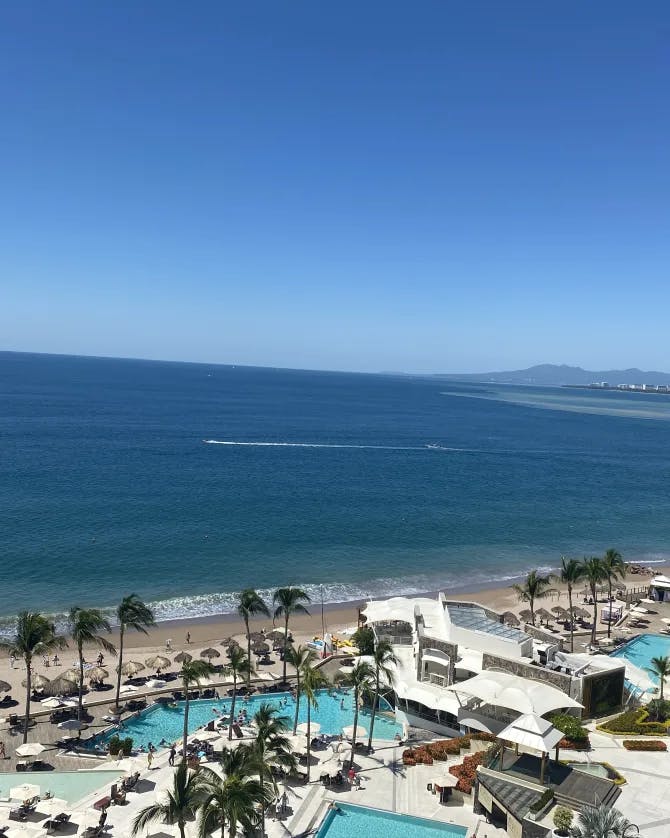 Blue skies over the beach during the day.