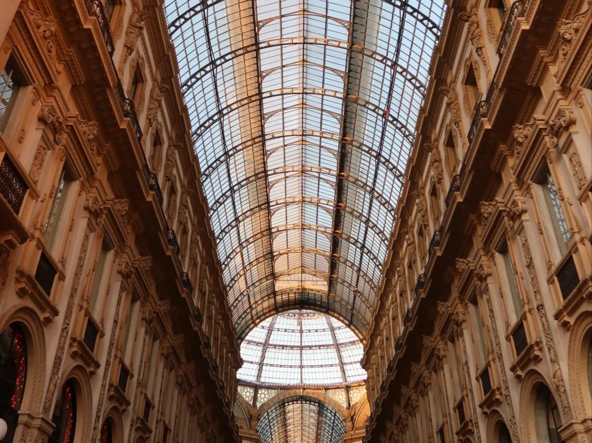 A view of the curved glass ceiling inside of the stunning Galleria Vittorio Emanuele II in Milan, Italy. 