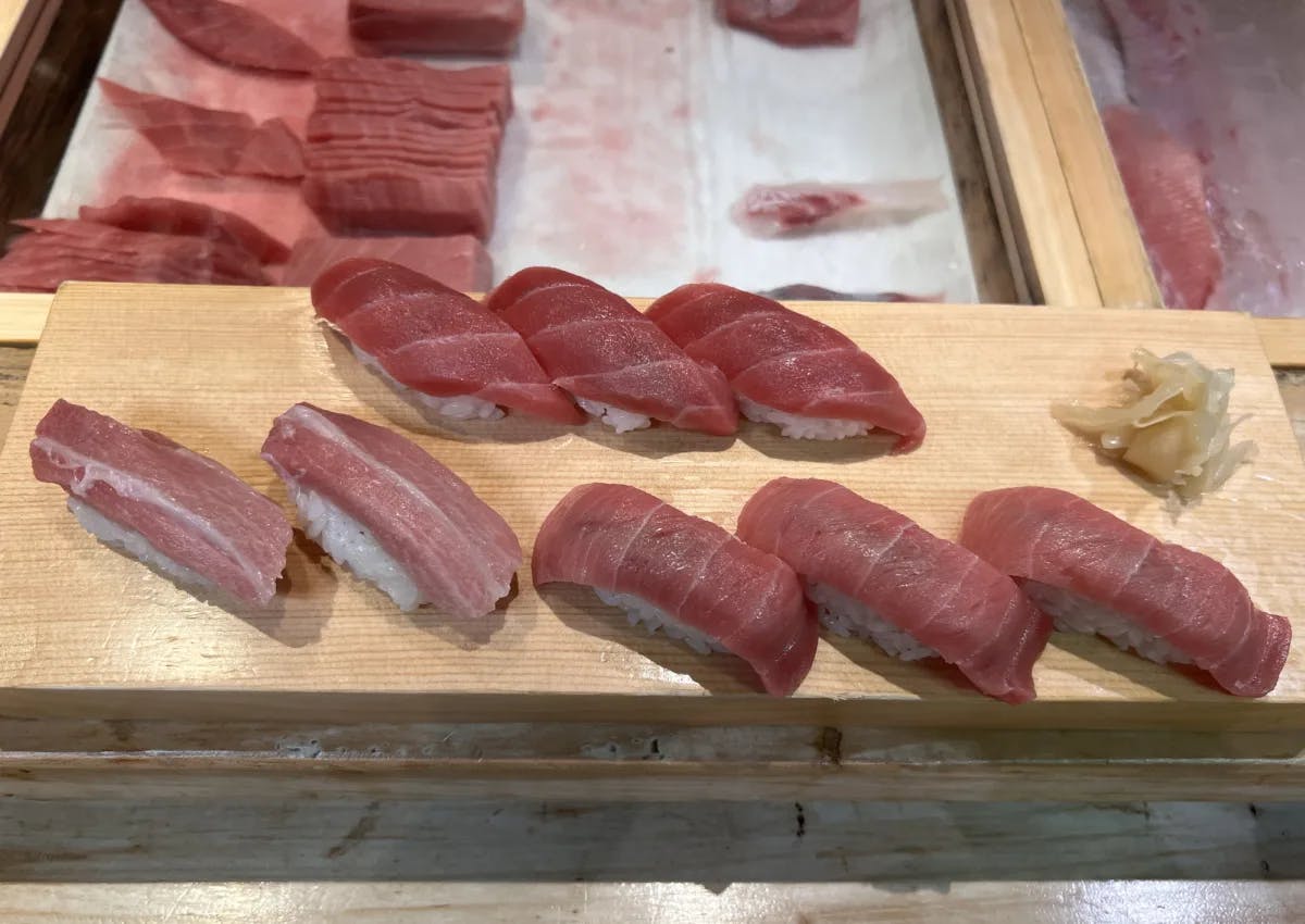 A tray with raw fish pieces. 