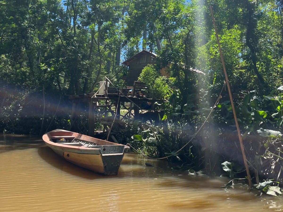 A boat docked in a river. 