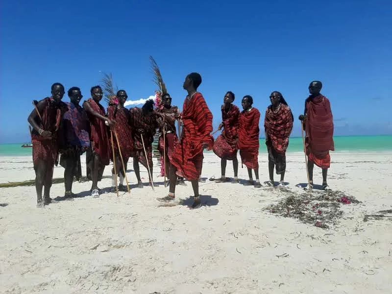 a group of people on a beach