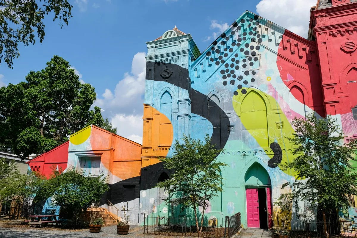 The colorful and artistic building of Culture House DC, a classical building painted with bright colors and patterns.