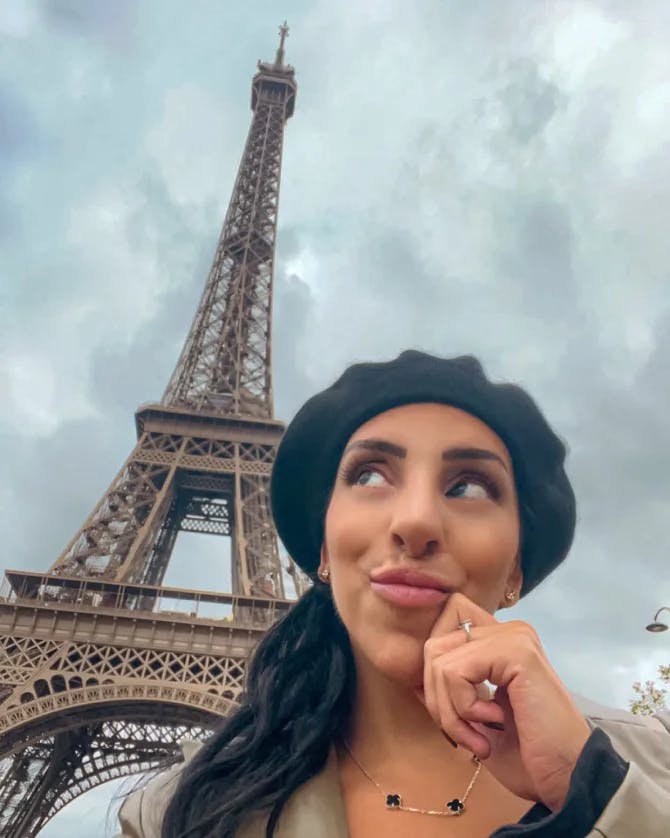 Samar Asfour posing outside of the Eiffel Tower