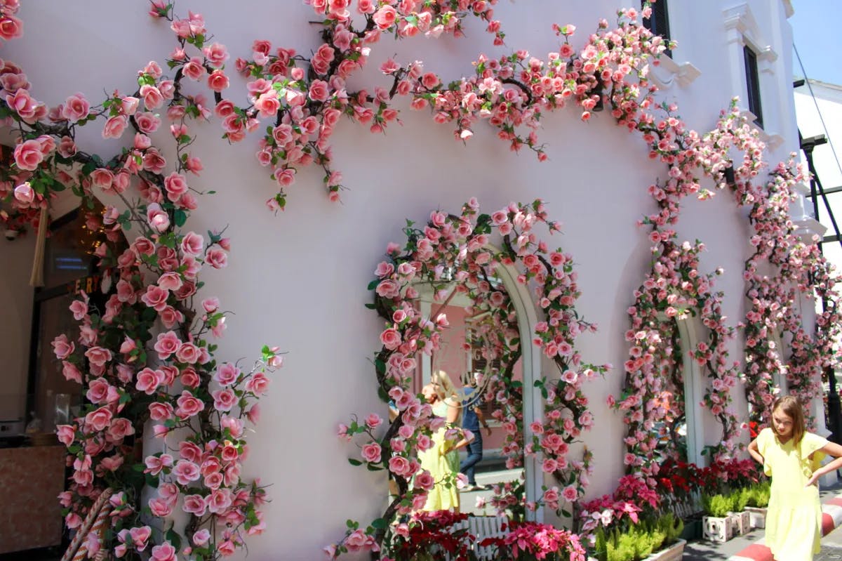 A building decorated with flowers in Old Town Phuket.