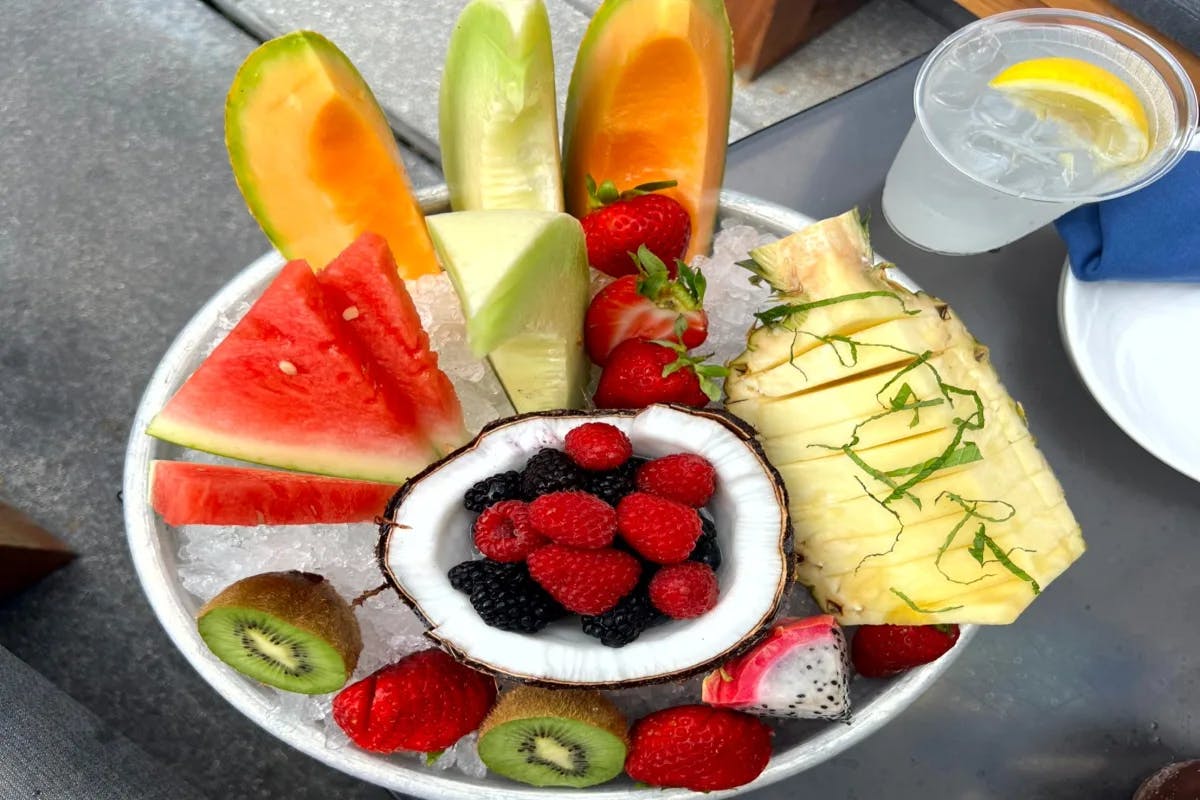 An aerial view of Exotic fruit salad served on a table during the daytime.