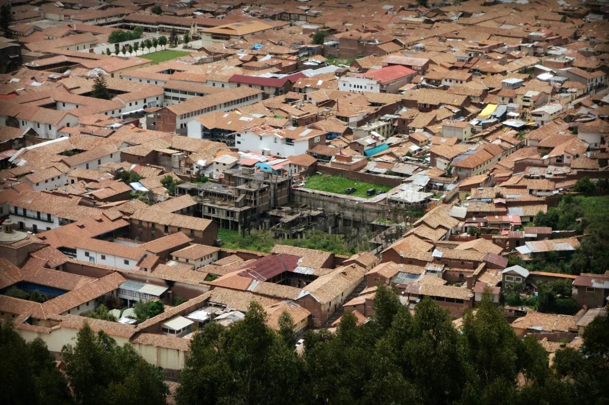 Aerial view of a city with brown roofs.