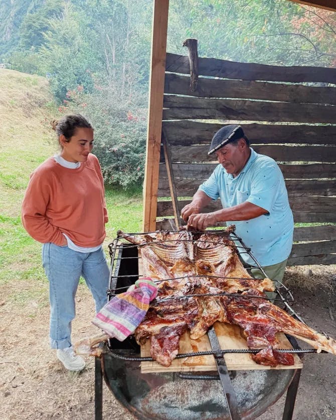 Travel advisor posing with a bbq grill