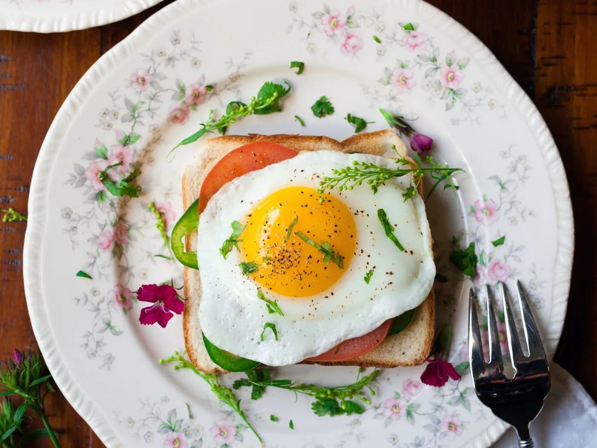 A plate with bread with a sunny side up egg. 