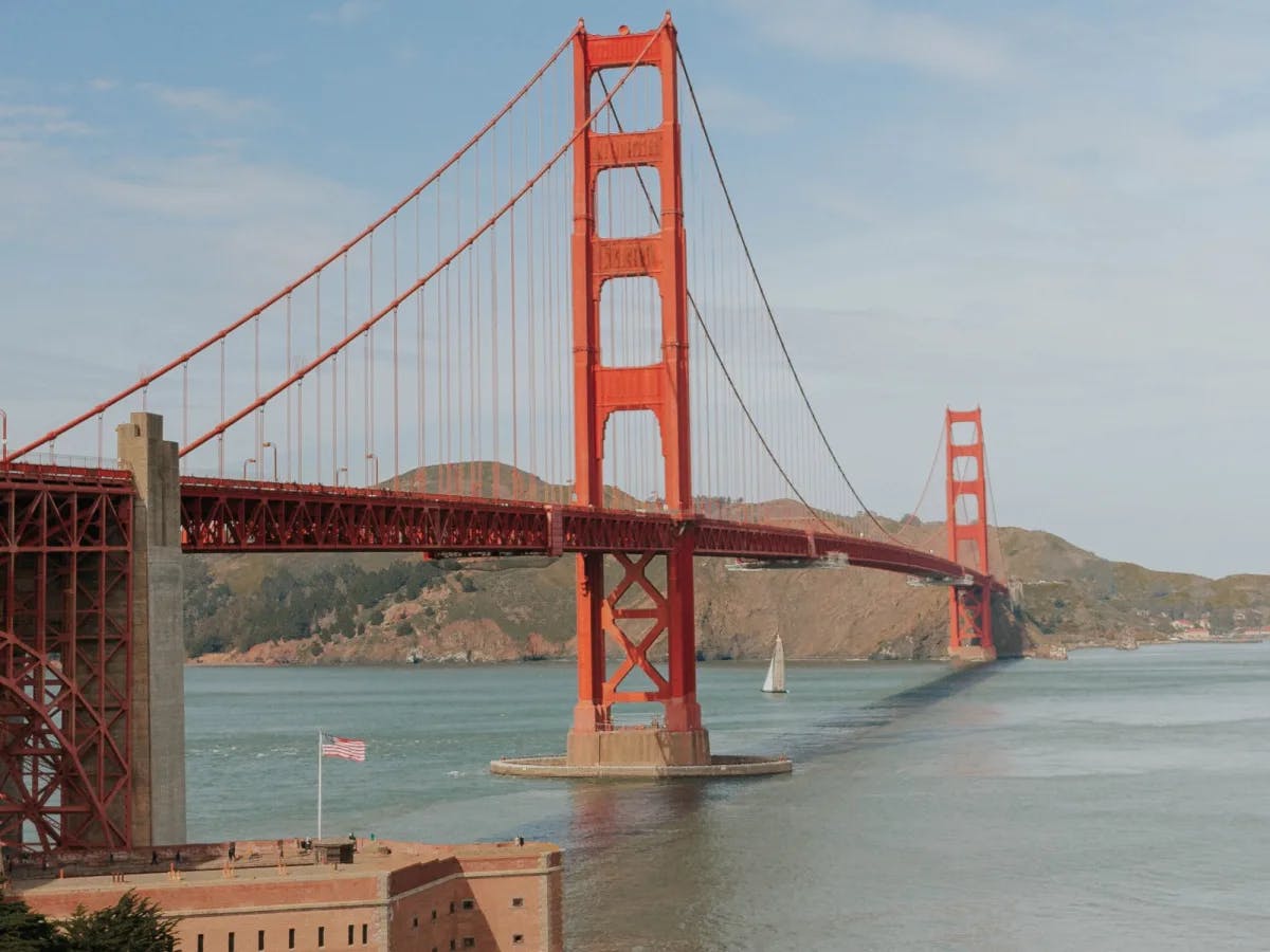 A red bridge during daytime. 