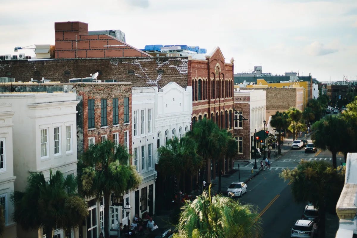 An aerial view of a city with white and red brick buildings during daytime.