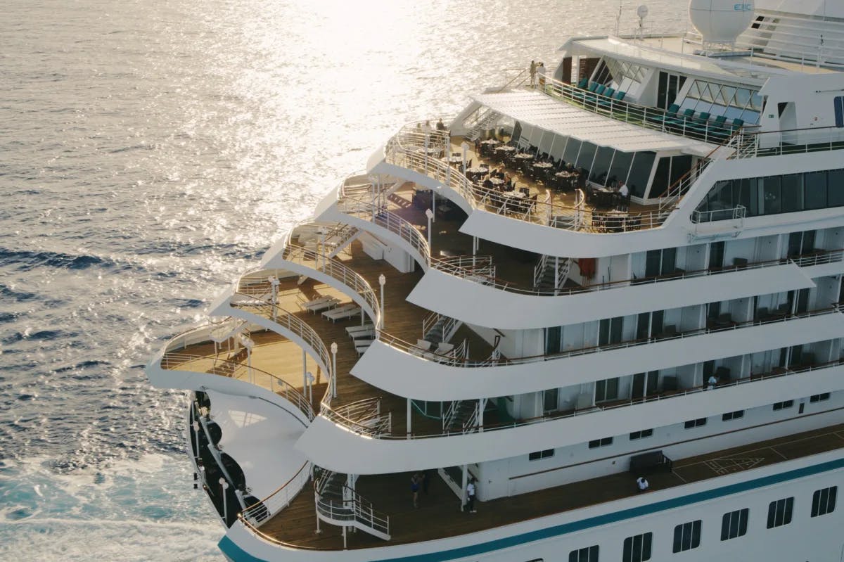 aerial view of a tiered balcony on the back of a cruise ship