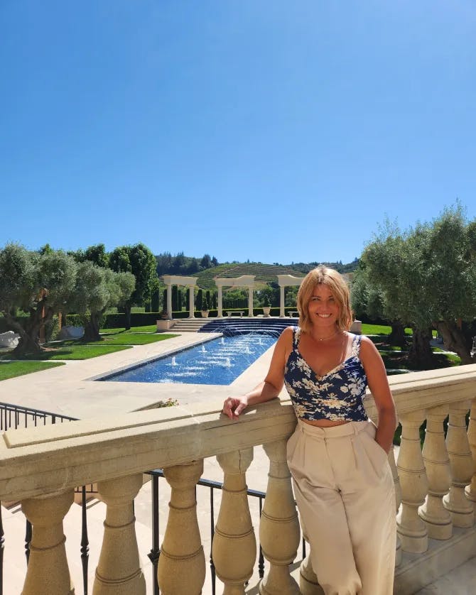 Posing by the lush green garden