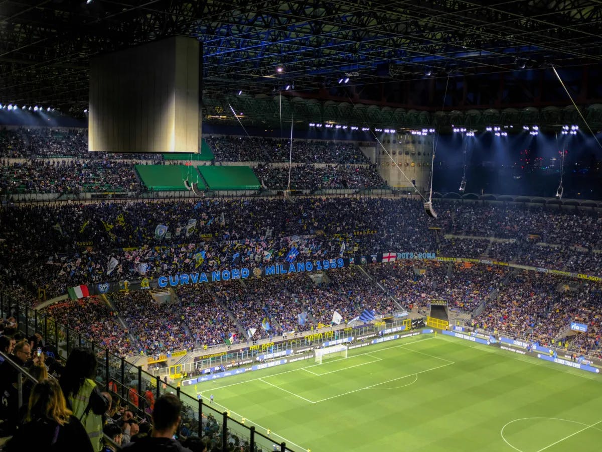 a-football-stadium-filled-with-lots-of-people-Italy-travel-guide