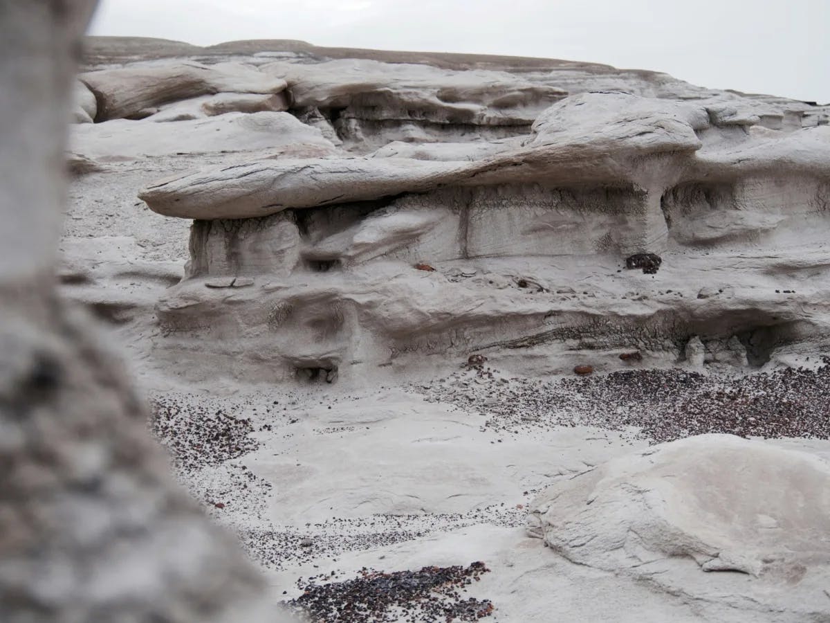 Gray Rock formations in a desert on an overcast day. 