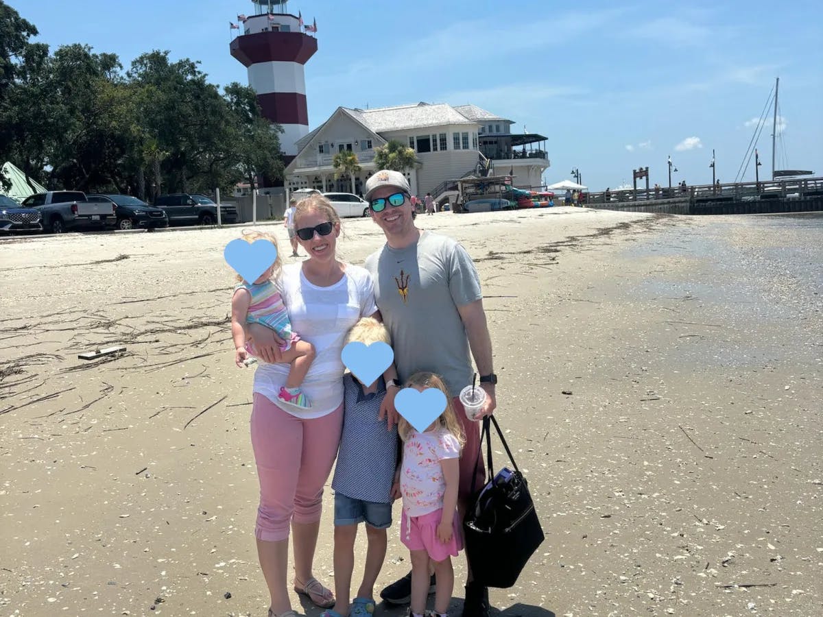 An image of a family at the beach on a sunny day. 