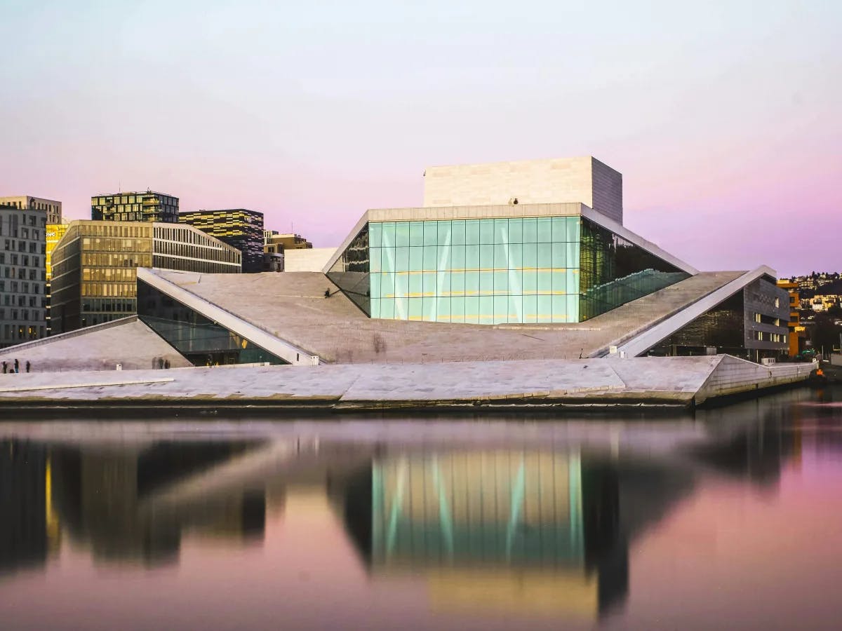 brown-and-white-concrete-building-near-body-of-water-Norway-travel-guide