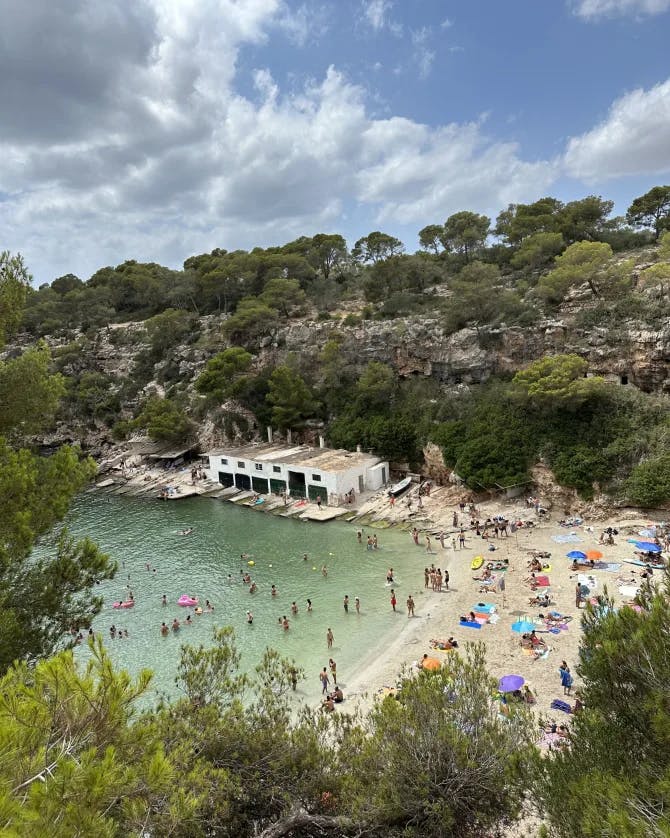 Aerial view of a water body with people on its shore.