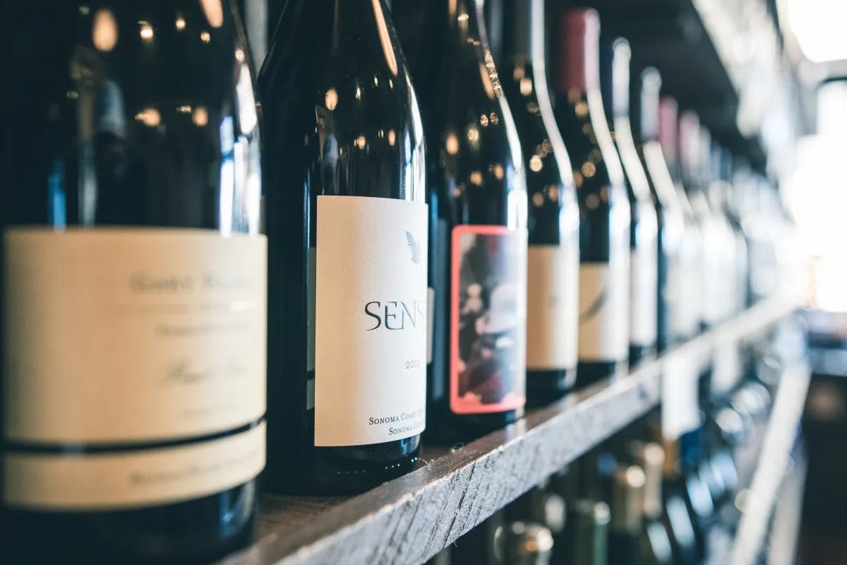 Organized bottles on a shelf.