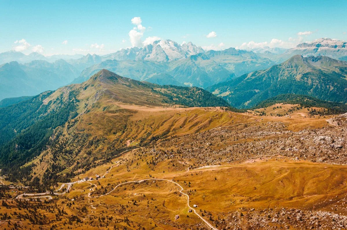 A stunning view of the raw and rugged landscape atop the Dolomites on a sunny day. 