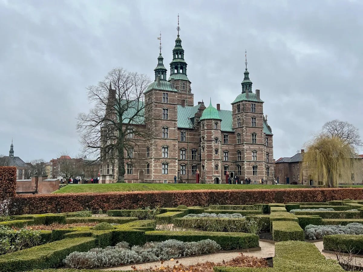 A far view of Rosenborg Castle during the daytime.