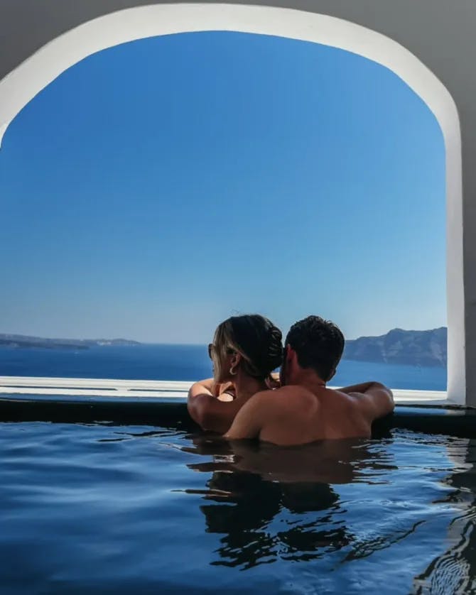 A couple posing in the swimming pool