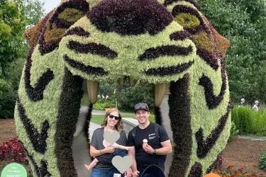 Chelsey with her family posing near a tiger shaped prom