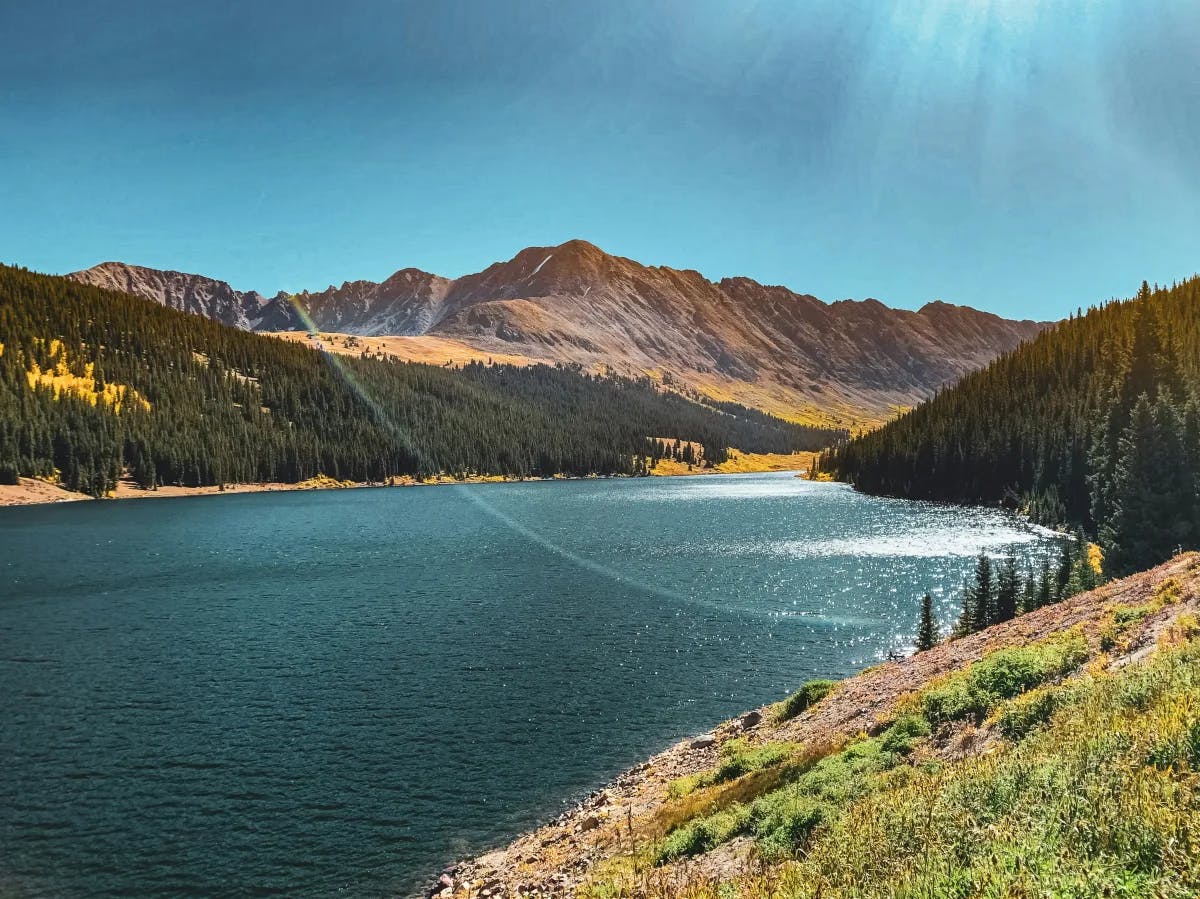 River surrounded by mountain range during the daytime