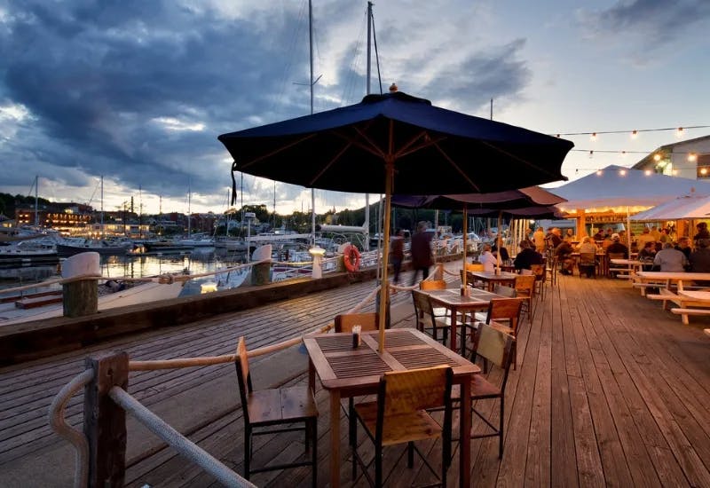 People having meal in an outdoor Maine restaurant at Midcoast