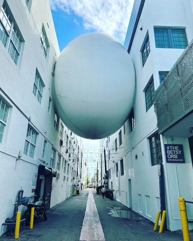 white building and huge ball