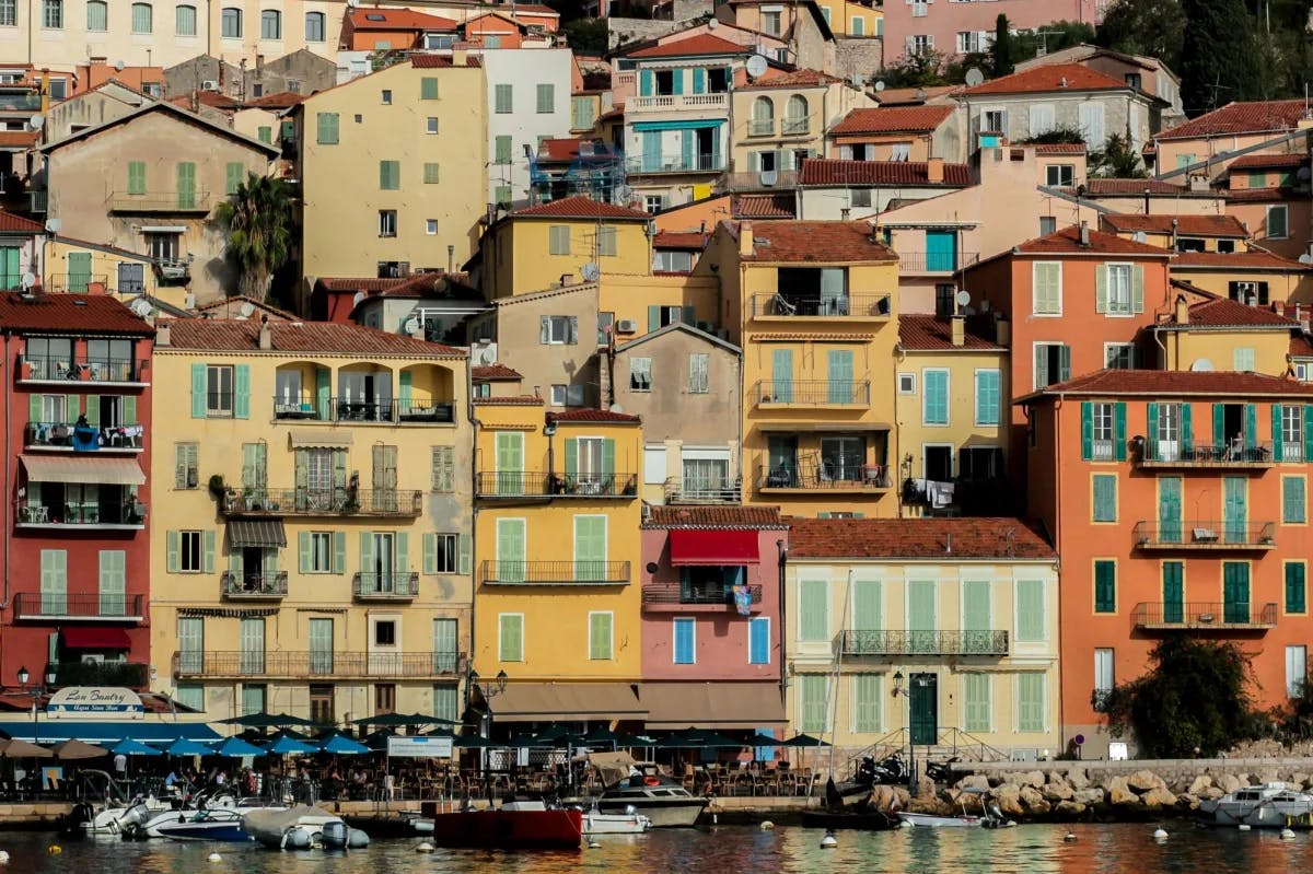 Colorful buildings near waterbody. 