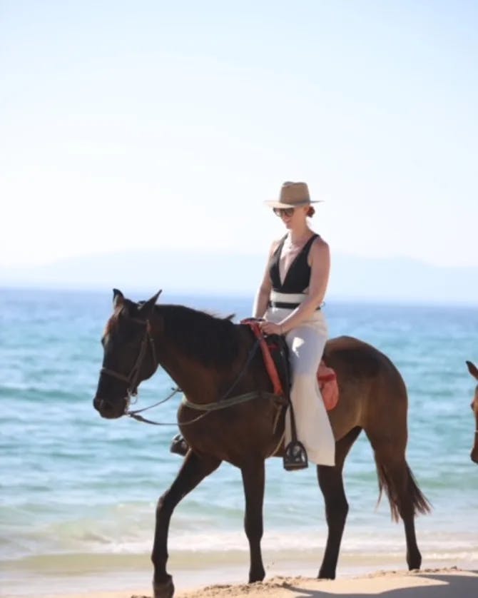 Travel advisor riding on a horse