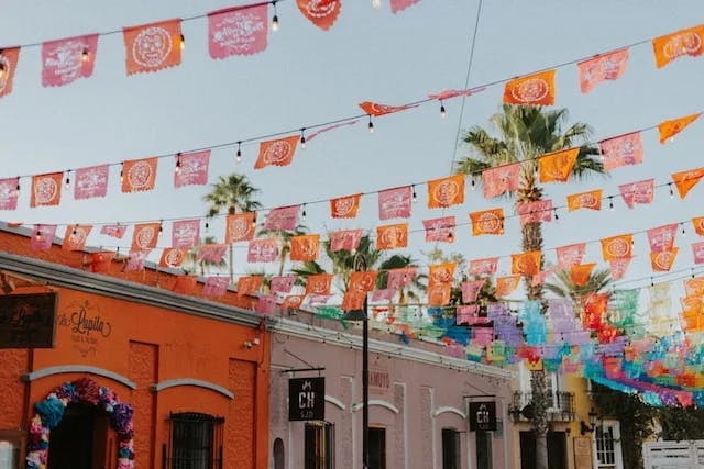 a bunch of flags that are hanging in the air