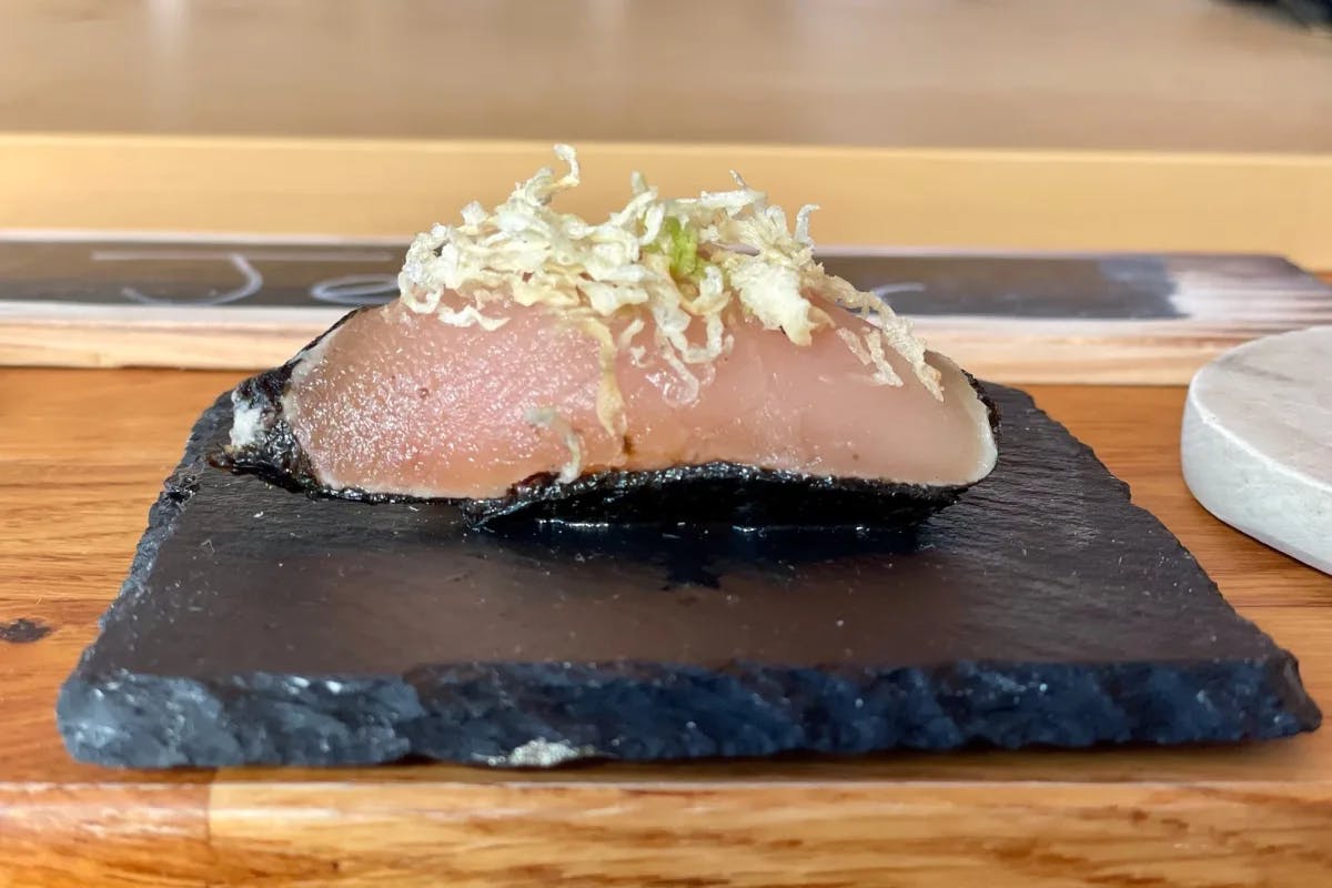 A picture of sushi served on a table.