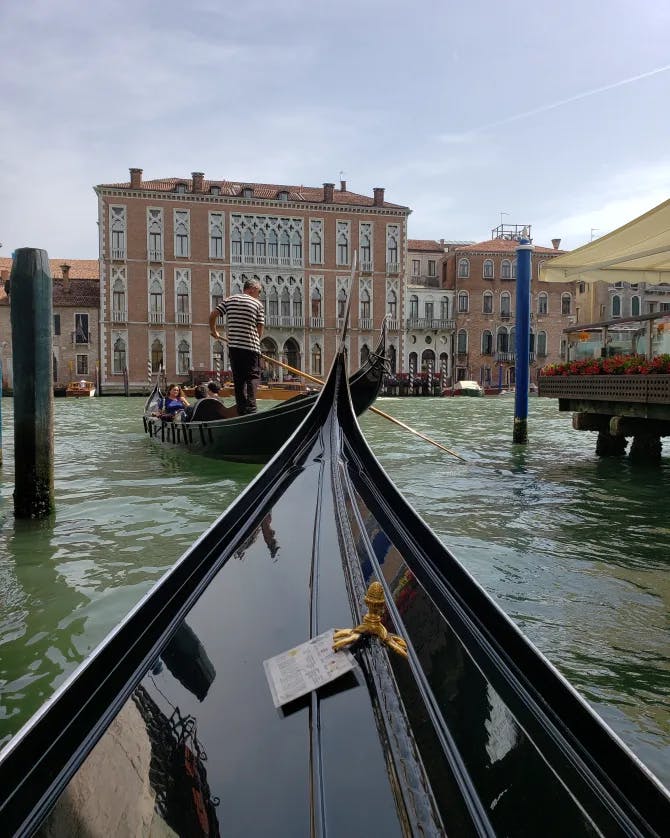 A man is riding a boat in the sea