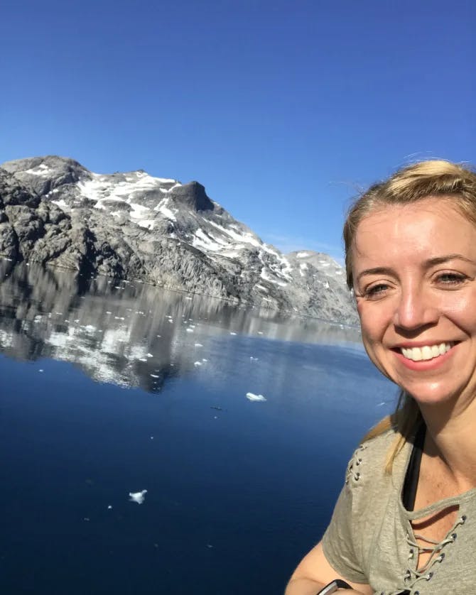 Picture of Marci with snow covered mountain