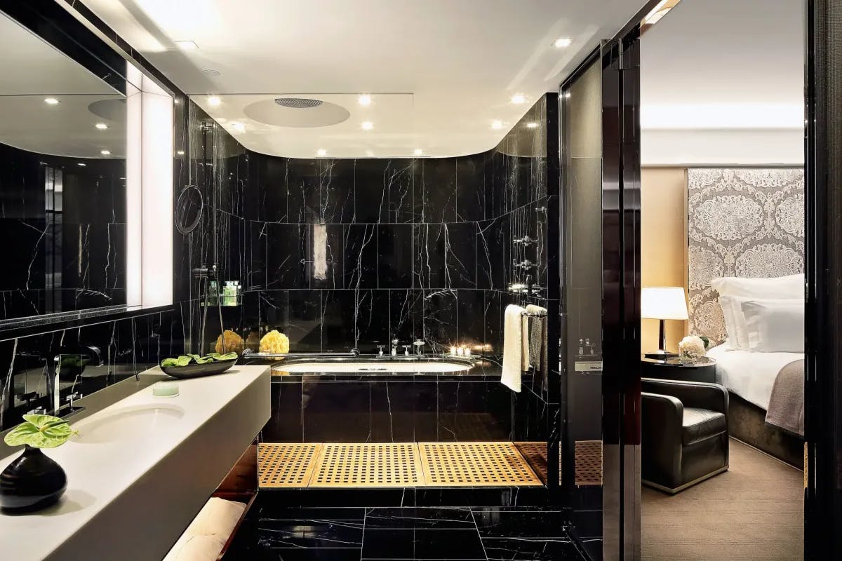 a black marble hotel bathroom