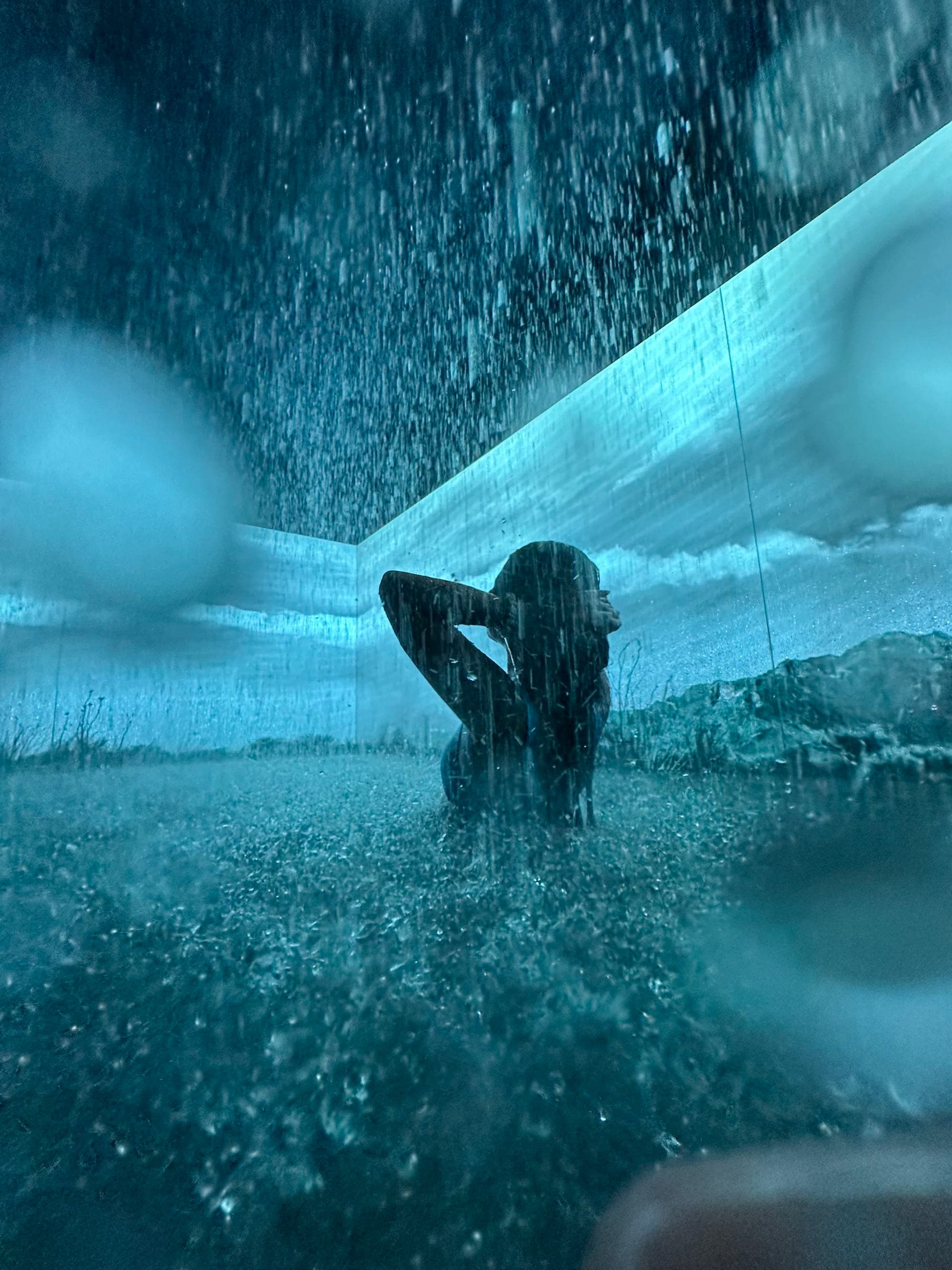 A person posing for a photo in a spa pool