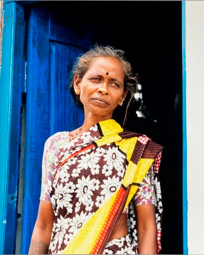 Woman wearing traditional saree and bindi on head