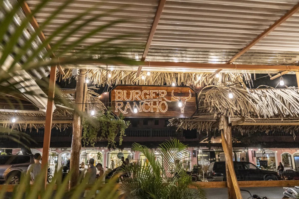 Burger Rancho restaurant sign on straw roof