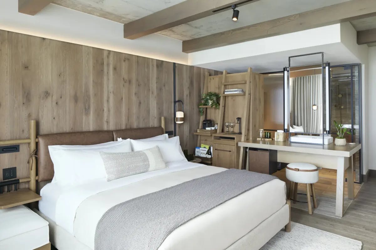 Natural hues, plants and mostly wooden furnishings feature in a 1 Hotel Nashville room