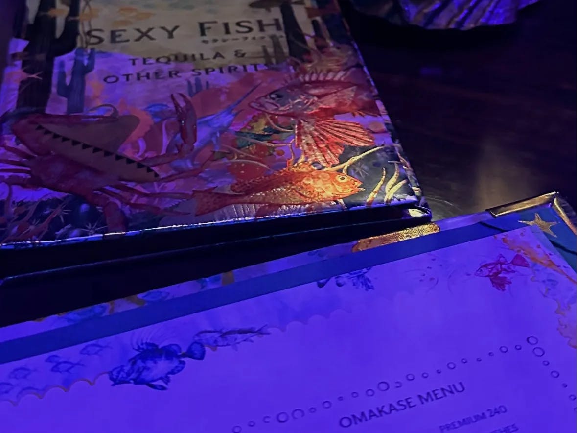 Menu card of a restaurant named Sexy Fish. 