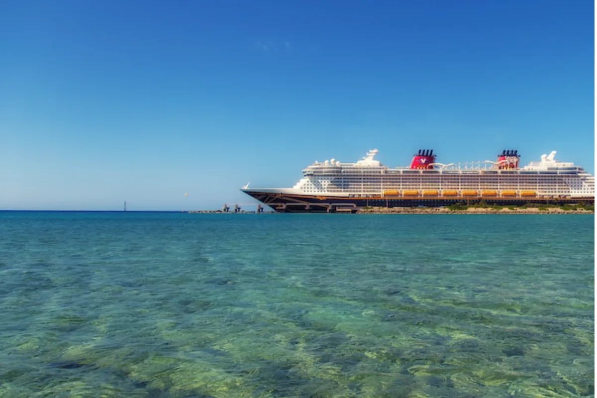 An aerial view of a cruise ship on the water during the daytime.